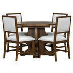Farmhouse Dining Set in round configuration with four white upholstered chairs tucked in, offering space-saving elegance.