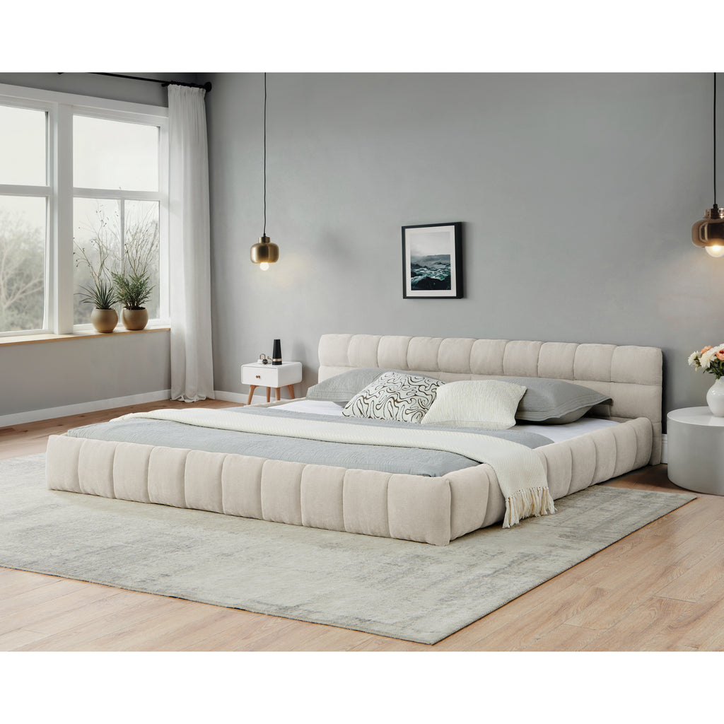 Beige chenille California King platform bed with a low-profile, channel-tufted upholstered frame in a modern bedroom.