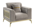 Contemporary taupe upholstered accent chair featuring channel tufting, gold wood accents, and matching throw pillow.