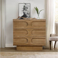 Modern light brown wooden cabinet featuring three drawers with distinct arched geometric detailing on a pedestal base.