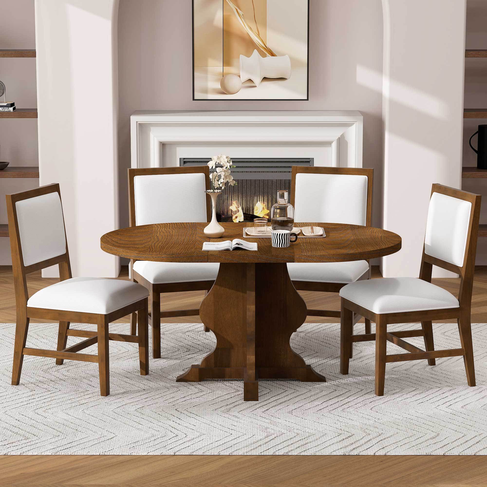 Farmhouse Dining Set - TREXM 5-Piece | Extendable Table featuring a round wooden table with pedestal base and four white upholstered chairs in a cozy dining room.