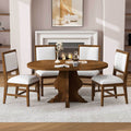 Farmhouse Dining Table Set with extendable oval table and four white upholstered chairs in a cozy modern living room. Trendy & practical for home dining.
