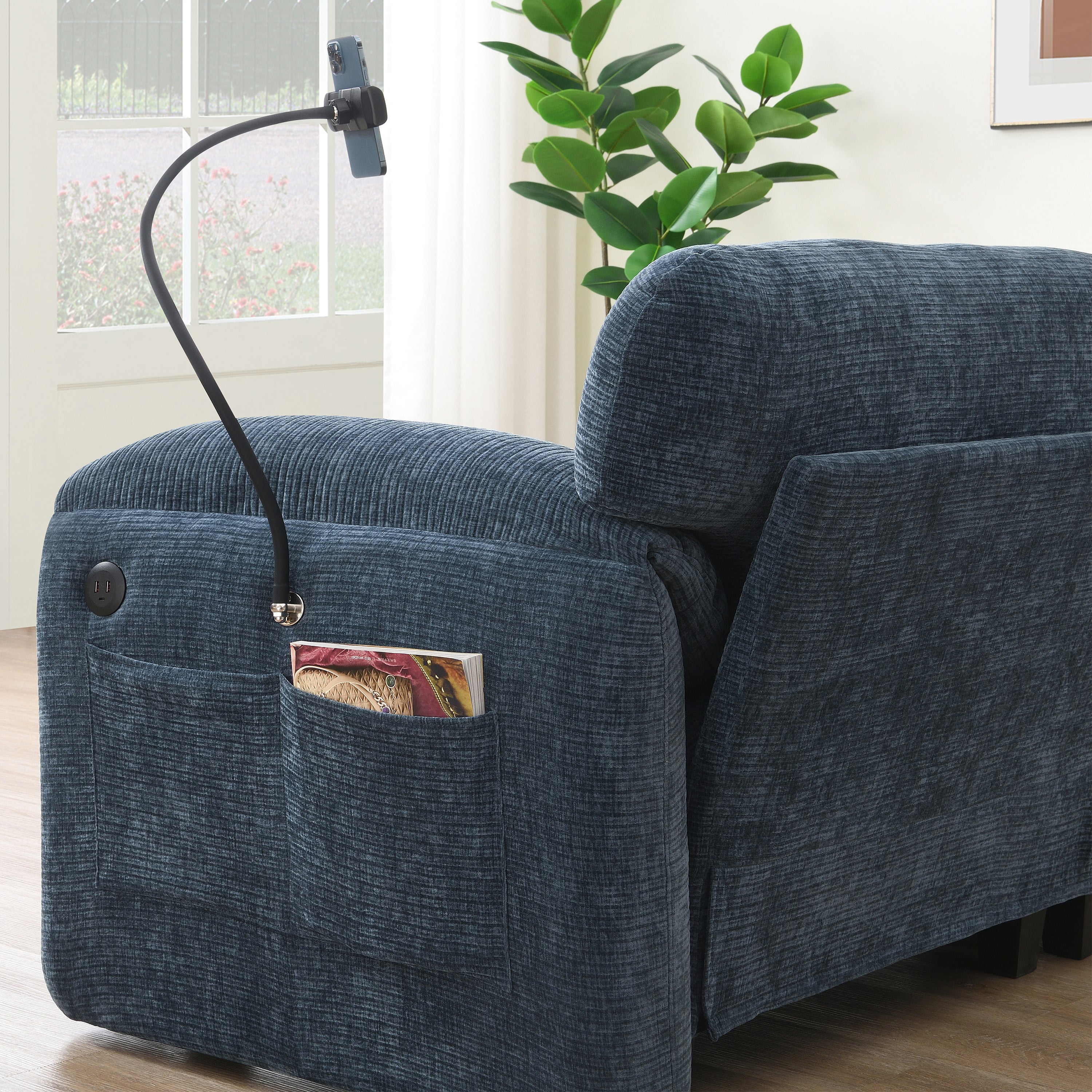 Back view of modular sofa with phone holder and USB ports, emphasizing tech integration and storage features.