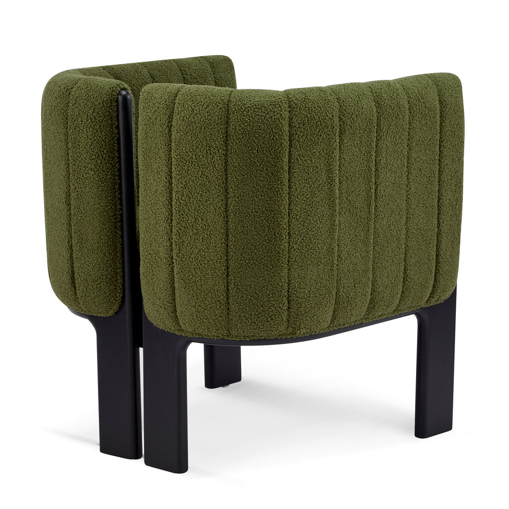 Rear angled view of a modern dining chair with olive green boucle upholstery and black legs, designed for chic and durable dining areas.