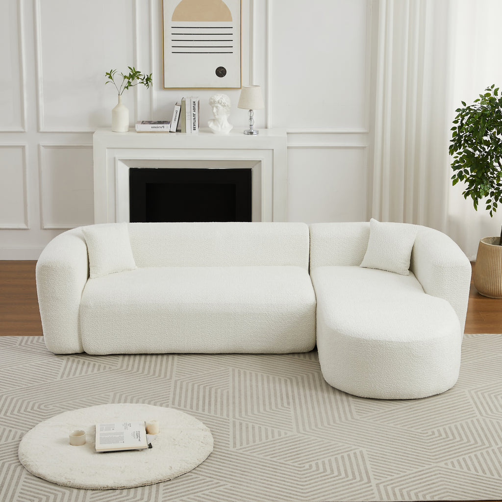 Modern 109.4' modular sofa in beige chenille fabric with right-facing chaise, set in a cozy living room with geometric rug.