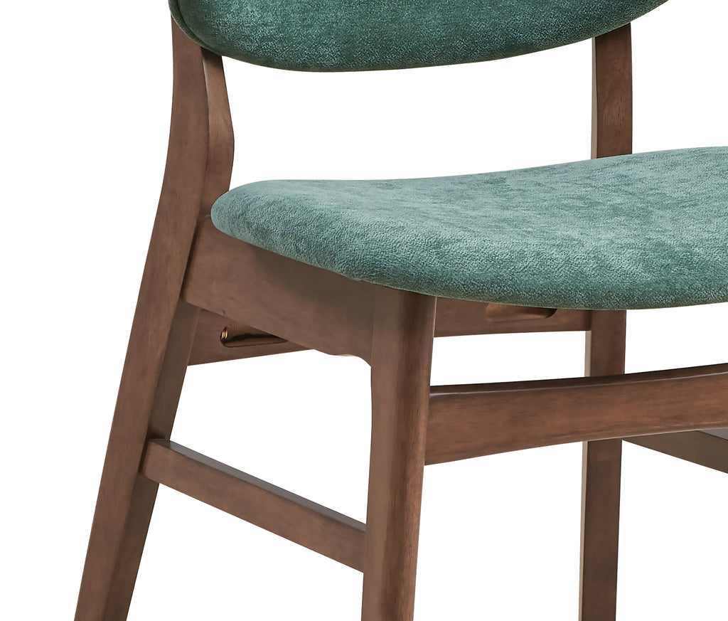 Detail of green upholstered seat and walnut frame from the dining chair, part of the modern walnut dining set with faux marble table.