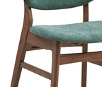 Detail of green upholstered seat and walnut frame from the dining chair, part of the modern walnut dining set with faux marble table.