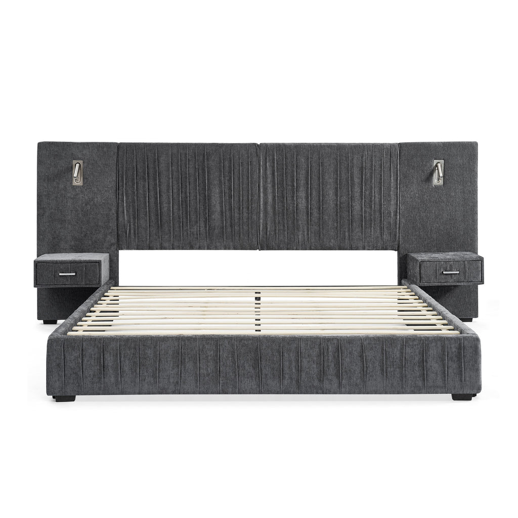 Front view of queen upholstered bed frame without mattress. Built-in bedside tables and lamps with pleated headboard and solid frame.