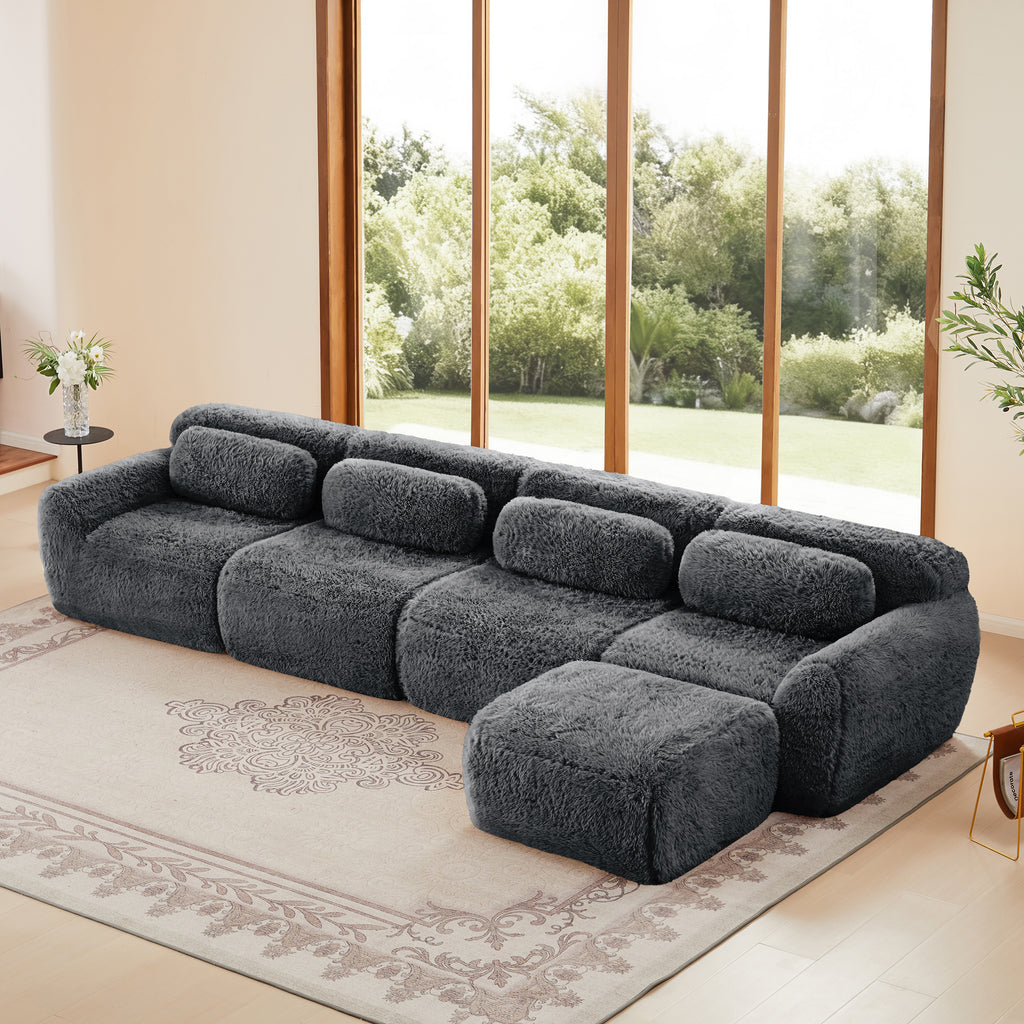 Dark grey modular sectional sofa in plush fabric with ergonomic backrests and ottoman, ideal for modern living rooms with no assembly required.
