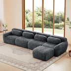 Dark grey modular sectional sofa in plush fabric with ergonomic backrests and ottoman, ideal for modern living rooms with no assembly required.