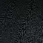 Close-up of black MDF tabletop with visible wood grain texture. Durable and stylish surface for modern dining settings.