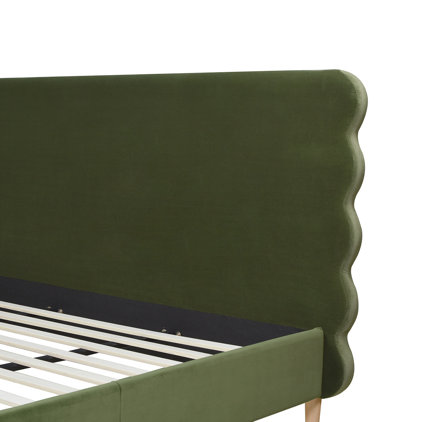 Close-up of Stockholm Modern king bed's olive green wavy headboard in performance velvet, showcasing elegant curves and sturdy frame.