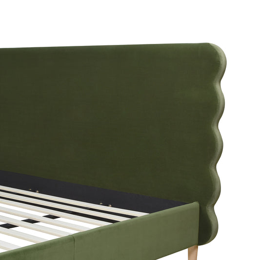 Close-up of Stockholm Modern king bed's olive green wavy headboard in performance velvet, showcasing elegant curves and sturdy frame.