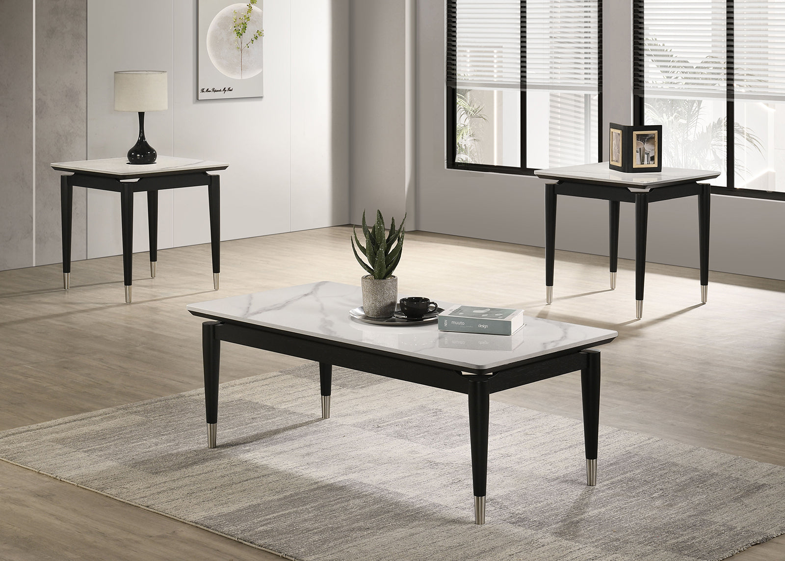 Full contemporary living room set featuring black and white coffee and end tables with sintered stone tops and silver-capped legs.