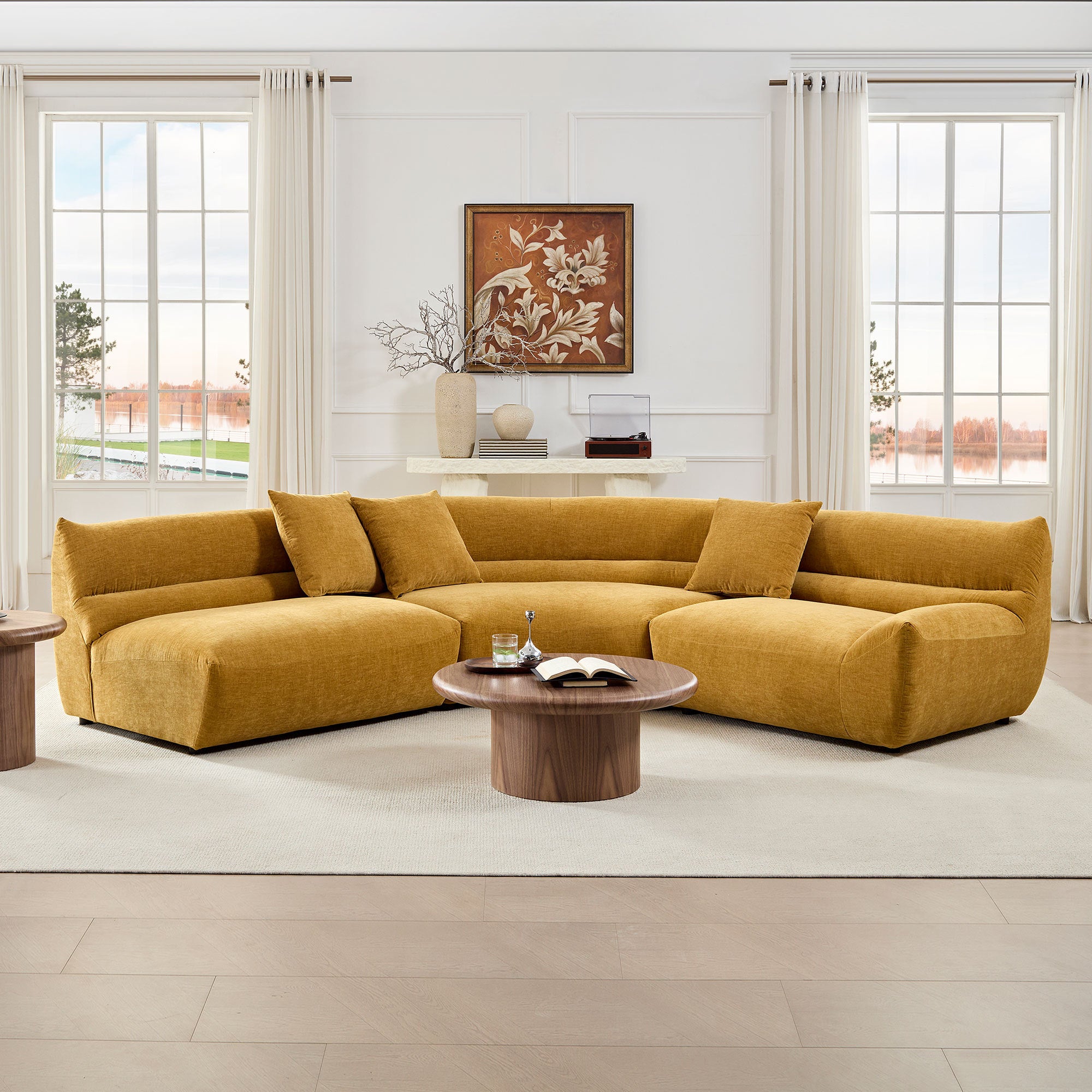 Mustard yellow, 3-piece modular curved sectional sofa in textured fabric with three matching throw pillows.