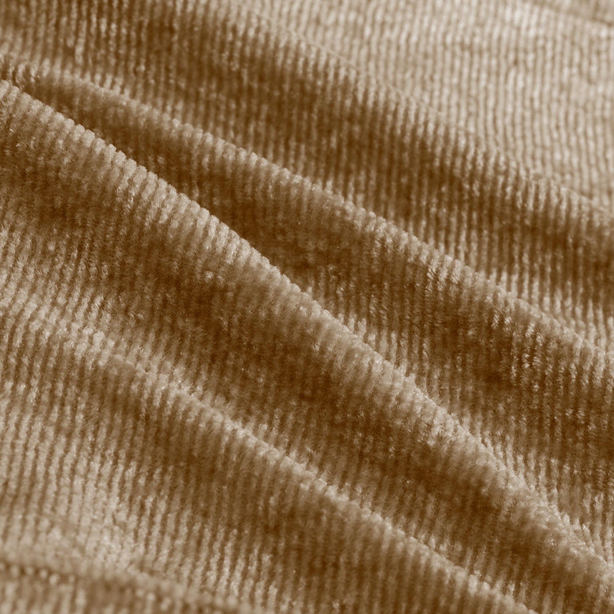 Close-up of velvet fabric texture on Modular Sectional Sofa. Rich, soft-touch material adds luxury to any living room.
