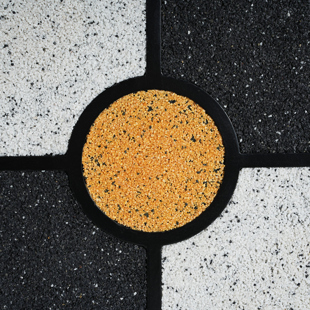 Close-up of the Four-Leaf Clover Accent Table’s golden terrazzo center, adding a vibrant focal point to the tabletop.