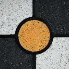 Close-up of the Four-Leaf Clover Accent Table’s golden terrazzo center, adding a vibrant focal point to the tabletop.