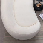 Top view of modern white curved sofa highlighting its smooth contours and spacious seating area.