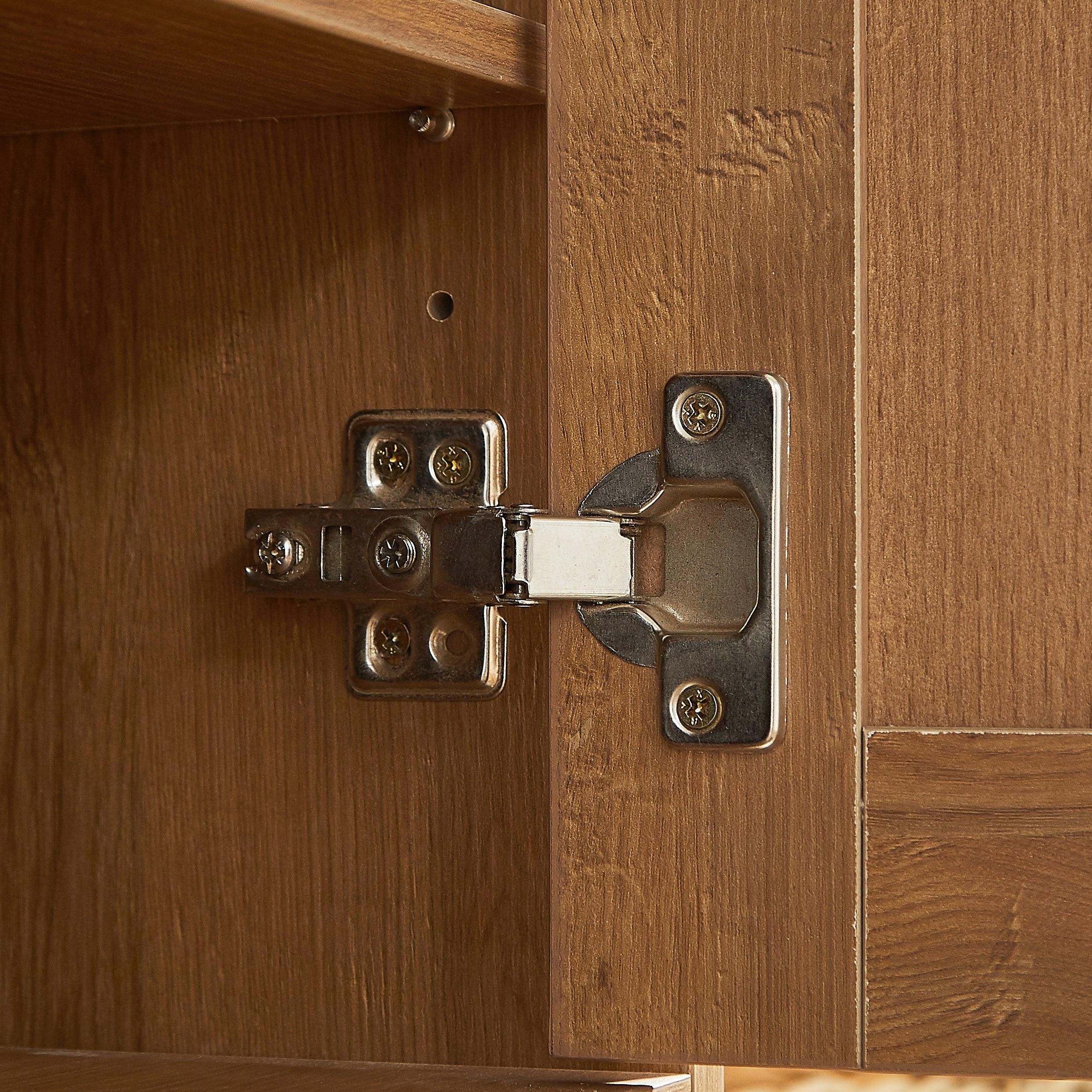 Close-up of metal hinge on rattan shoe cabinet door. Durable hardware ensures smooth and secure door operation.