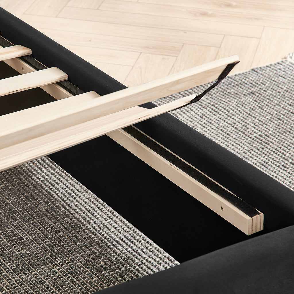 Detail of wooden slats on queen size bed frame, highlighting the solid support system and easy assembly design.