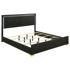 Modern black engineered wood eastern king bed frame featuring a built-in LED headboard and elegant gold accent feet.