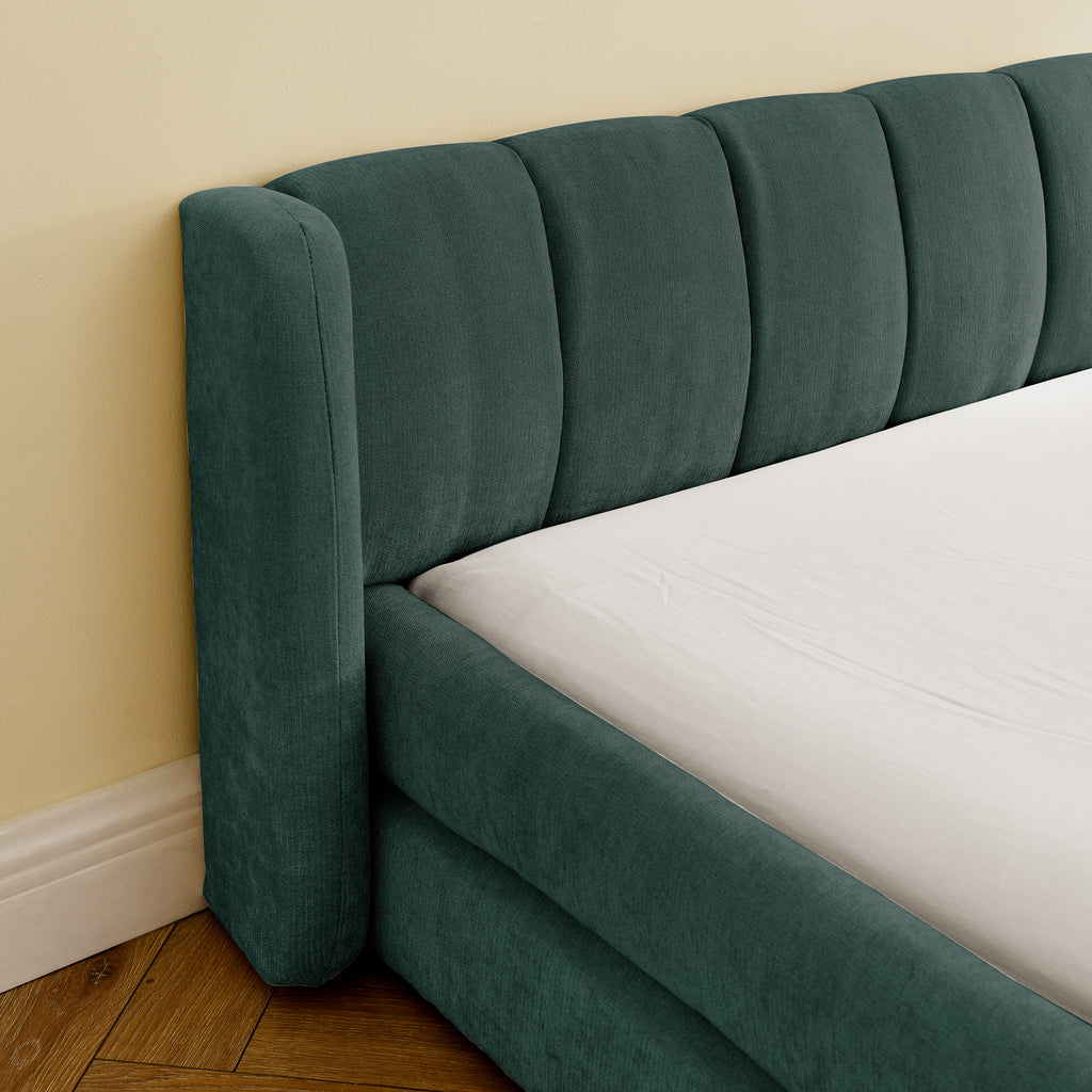 Detailed view of green chenille upholstered headboard with vertical tufting, part of a stylish king size bed frame.