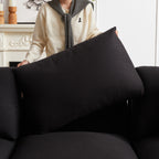 Close-up of person adjusting a back cushion on the modular L-shaped sofa, emphasizing removable and supportive pillows.