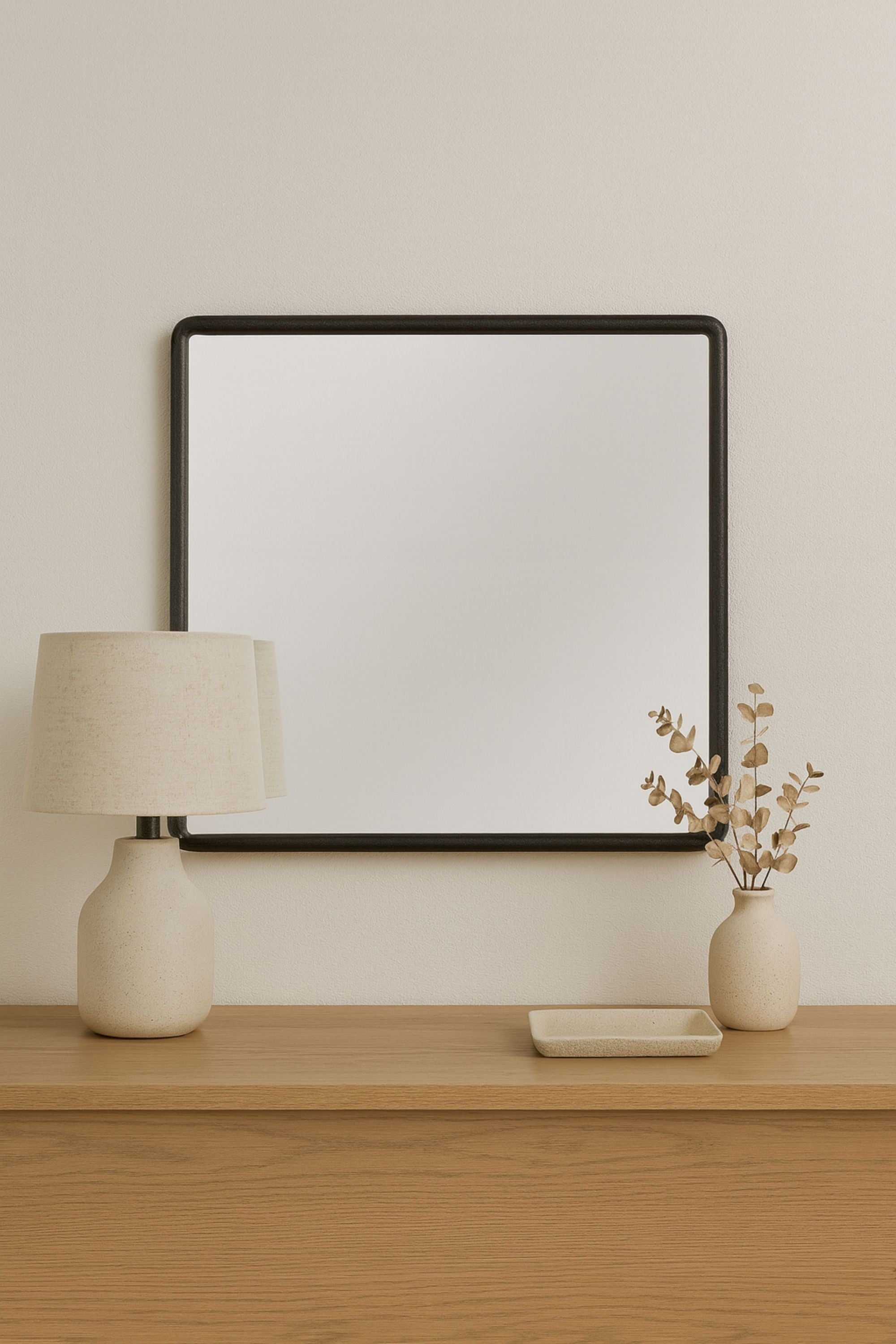 Square Elm Veneer Frame Mirror - Peppercorn Wood mounted above a wooden console, styled with neutral décor for a minimalist modern look.