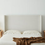 Hosford Minimalist Upholstered Wingback Bed - California King.
