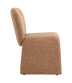 Side profile of modern fabric chair with ergonomic backrest and seamless arch leg design. Upholstered in brown boucle fabric.