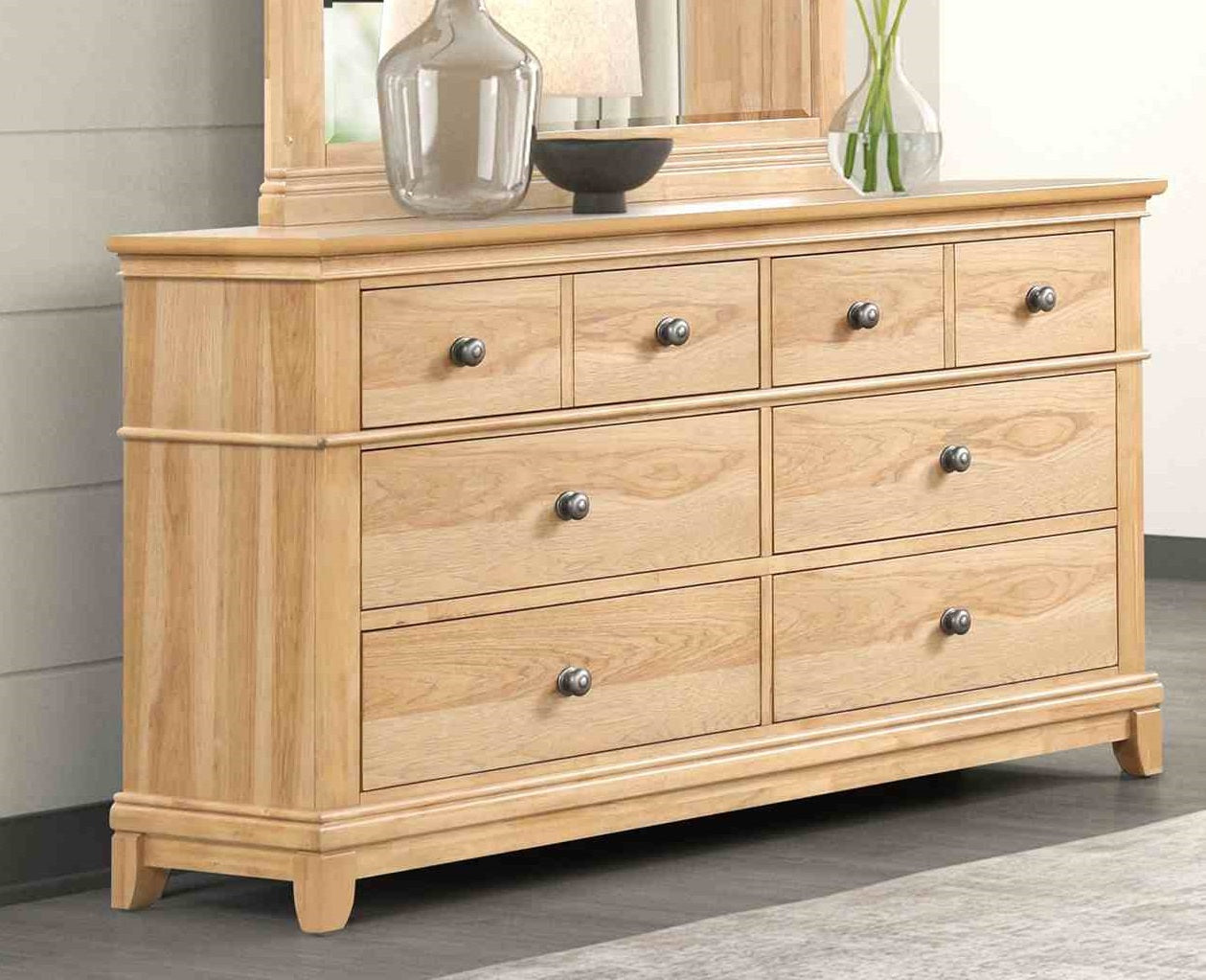 Natural Oak Storage Dresser placed in a bedroom setting, showcasing its elegant design and ample drawer storage.