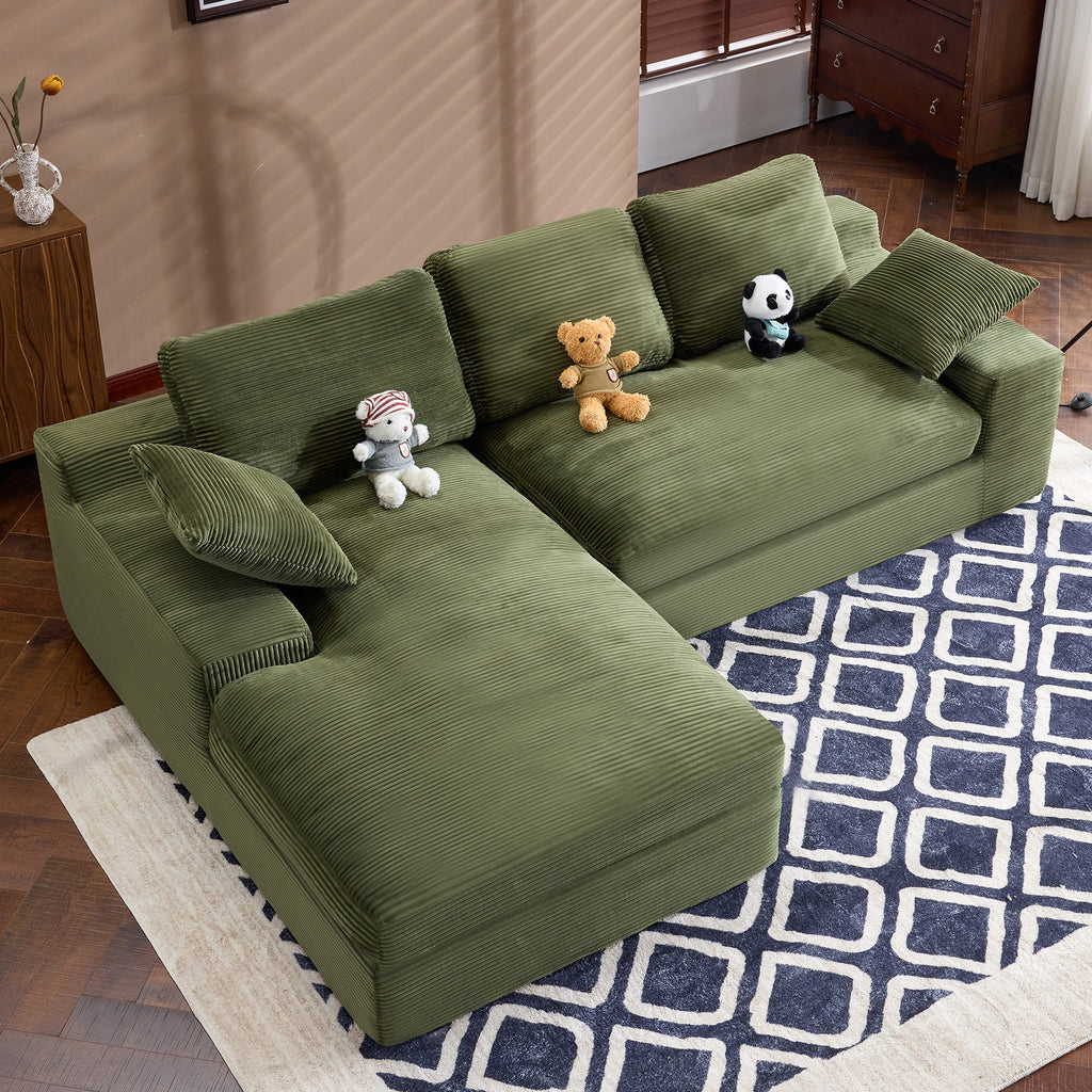 Top view of green corduroy sofa with L-shape design and foam-filled cushions. Perfect for small spaces and modern decor.