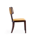 Side profile of camel wood dining chair with solid beech legs and camel faux leather seat, highlighting ergonomic backrest curve.