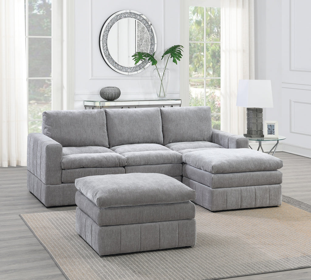 Plush granite-colored modular sectional with two ottomans, featuring clean contemporary lines and soft fabric upholstery.
