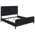 Modern Eastern king bed frame in black with a wire-brushed wood finish and vertical fluted detailing on head and foot.