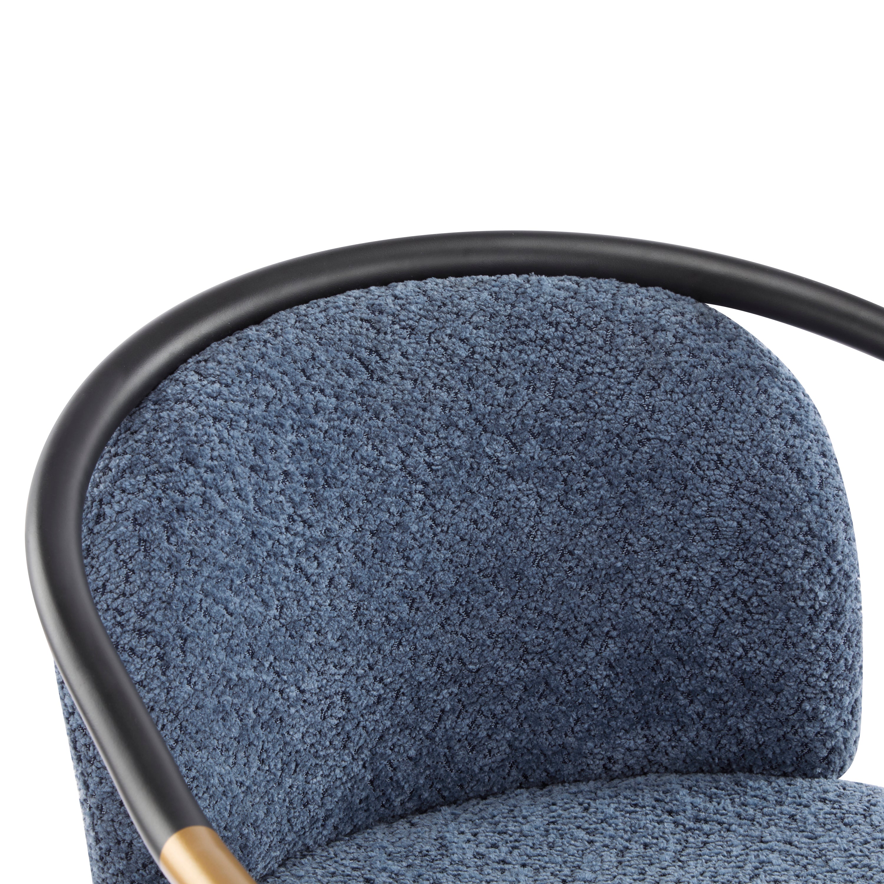 Detailed view of the curved backrest upholstered in blue fabric, supported by a sleek black metal frame for modern appeal.