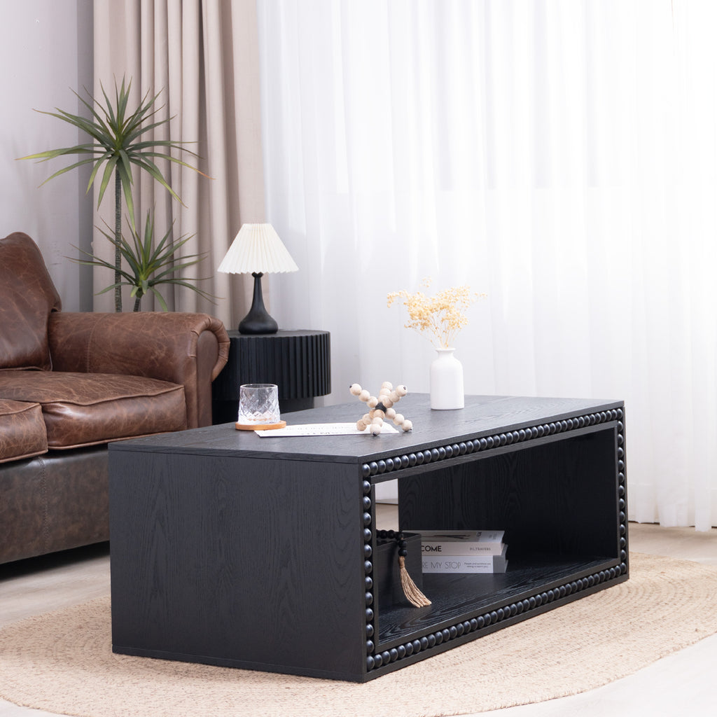 Black Beaded Coffee Table with Storage Shelf placed in a cozy living room setup, blending modern and farmhouse decor elements.