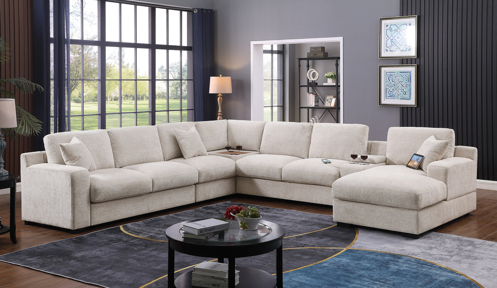 Beige chenille sectional sofa with chaise, cupholders, and USB ports styled in a contemporary living room interior.