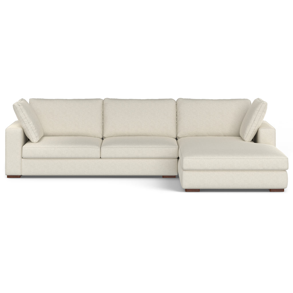 Cream performance fabric sectional sofa with deep cushions and a solid wood frame, featuring a right-side chaise.