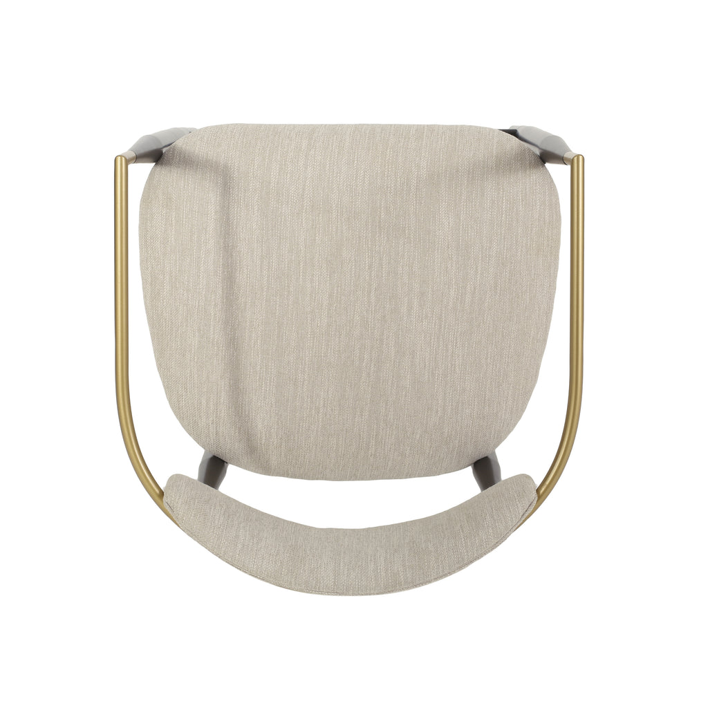 Top-down view of modern counter stool with curved gold backrest and soft beige cushion for stylish seating.