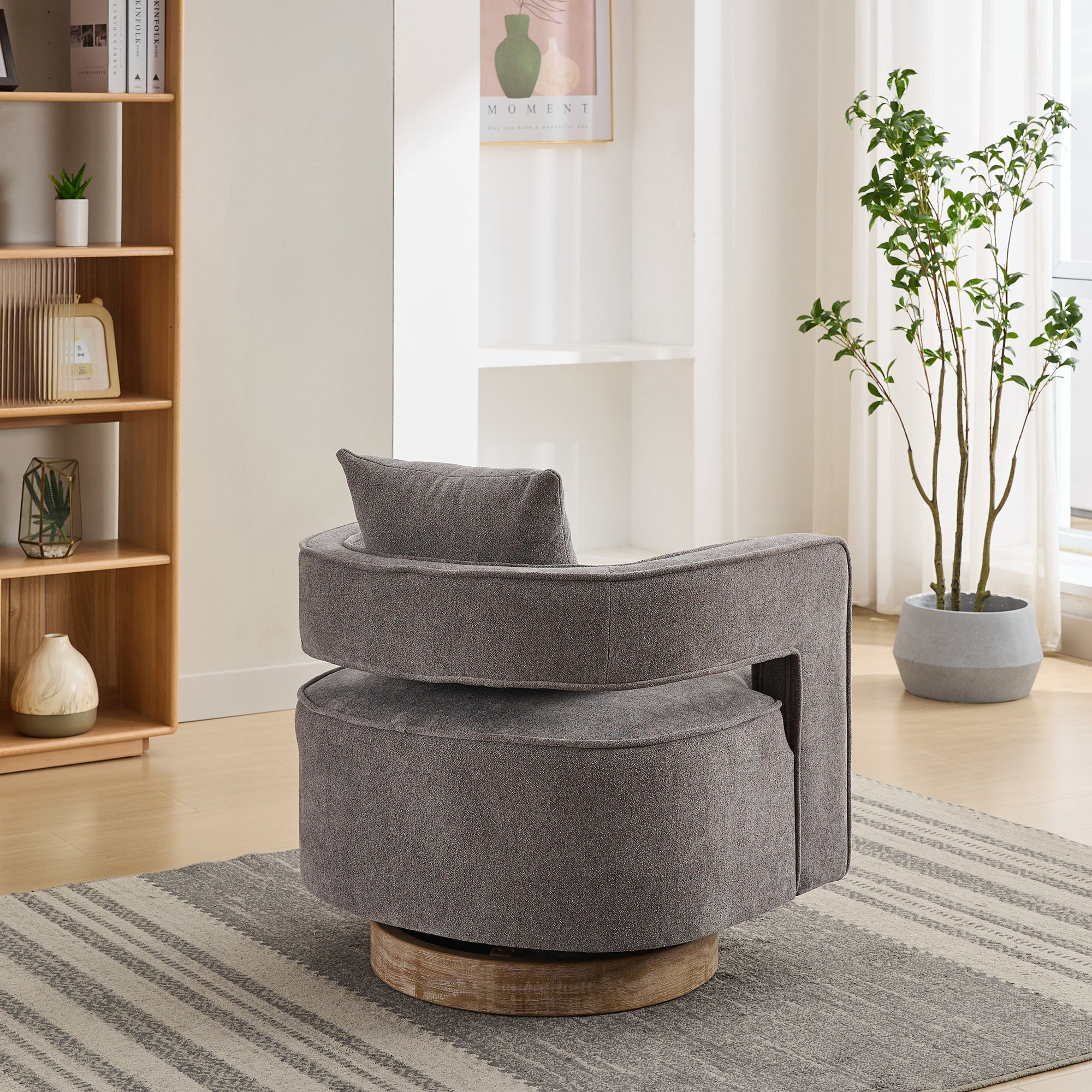 Back view of Swivel Accent Chair with open back design and linen blend fabric, supported by a weathered circular wood base.