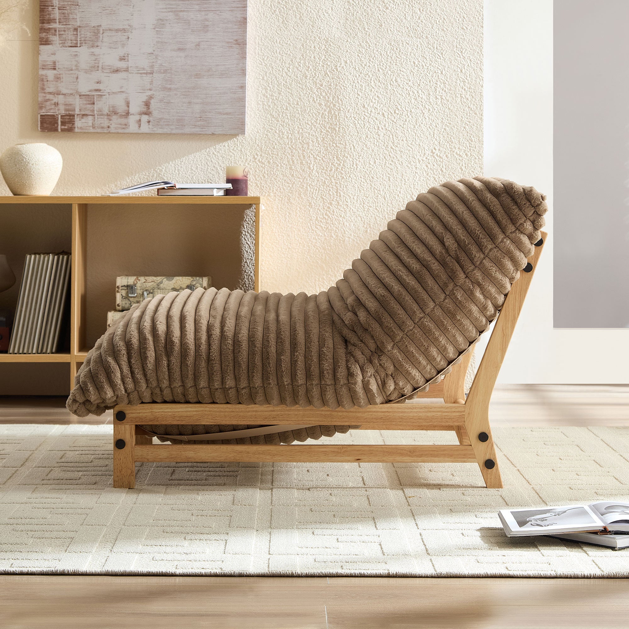Side view of corduroy accent chair with curved backrest and wooden base, ideal for relaxing in a cozy living room.