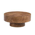 Round walnut burl wood coffee table with a modern pedestal base, featuring a rich, natural wood grain pattern.