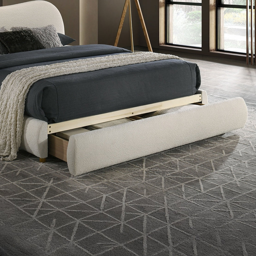 Close-up of Velvet King Size Bed footboard drawer extended, showcasing hidden storage functionality in a stylish bedroom setting.
