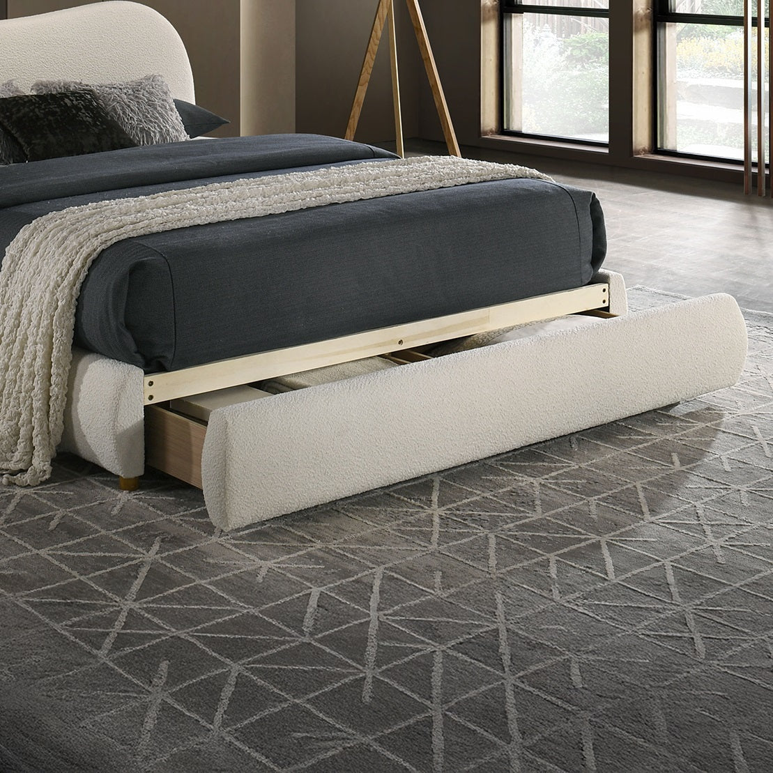 Close-up of Velvet King Size Bed footboard drawer extended, showcasing hidden storage functionality in a stylish bedroom setting.