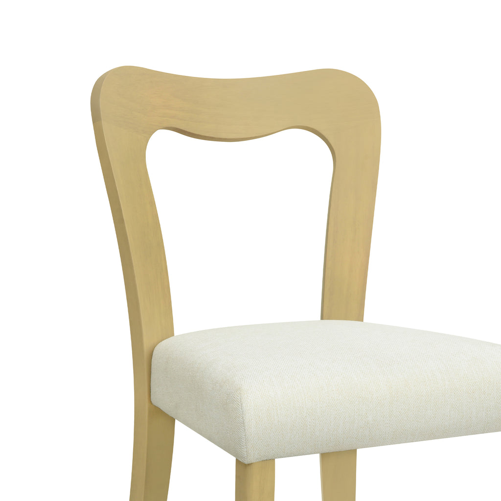 Detail of the curved backrest and beige seat cushion on a contemporary dining chair with light ash wood frame.