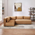 Cognac velvet modular sectional sofa with plush cushions in a modern living room setting.