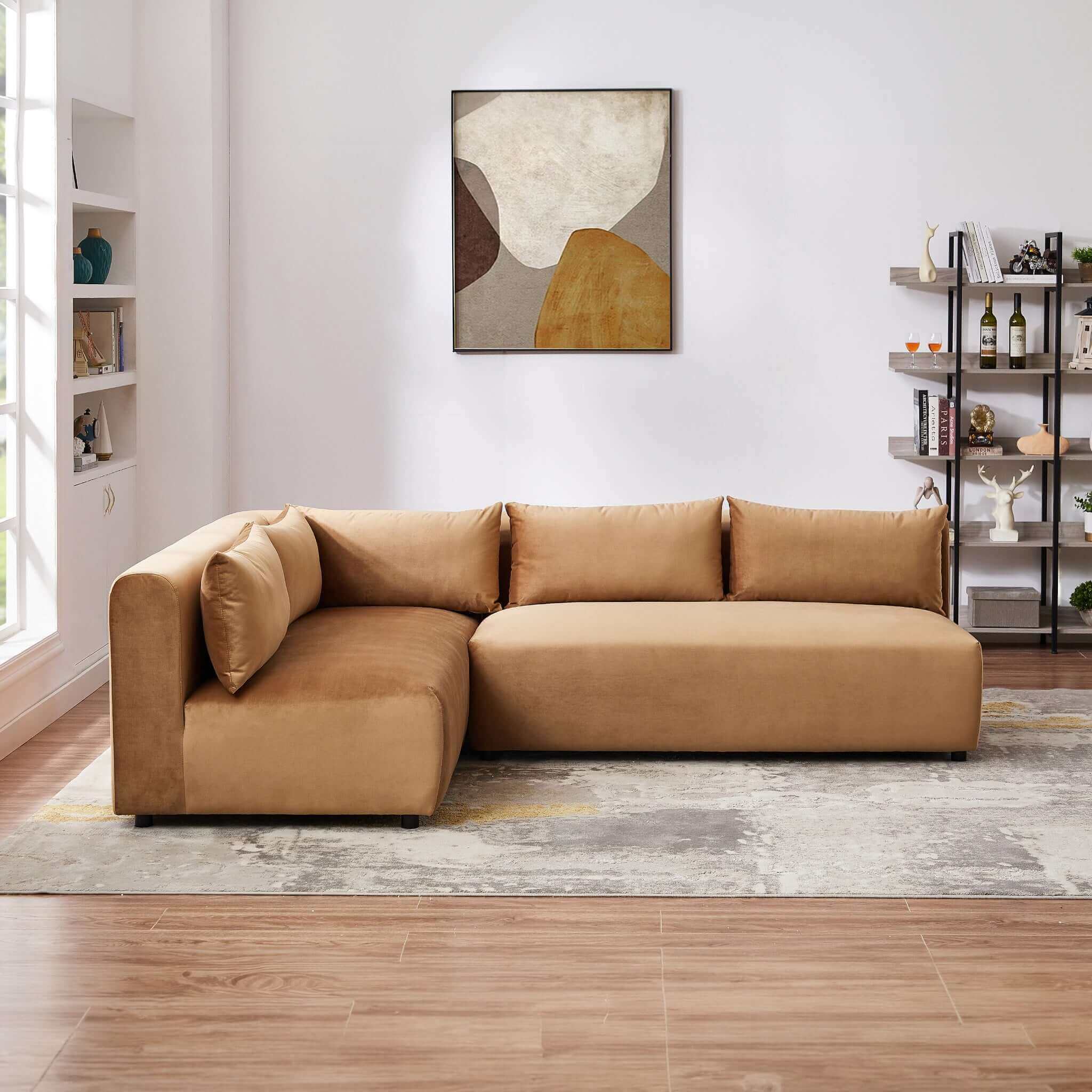 Cognac velvet modular sectional sofa with plush cushions in a modern living room setting.