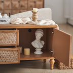 Interior cabinet space of the Rattan TV Stand Mid Century with Storage, showing adjustable shelving and decor setup.